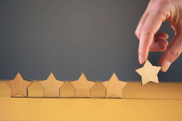 istock Man holding wooden stars. 1383127773