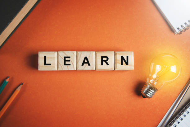 istock learn on wooden cubes with light bulb 1383127790