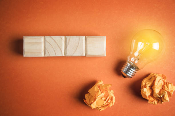 istock Wooden cubes and lightbulb mockup 1383127791