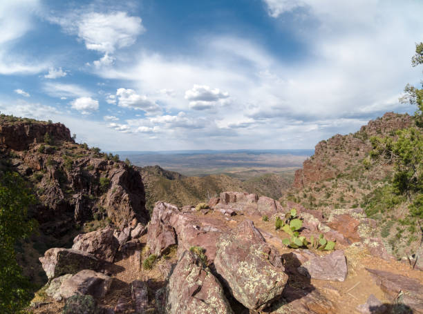 istock Big view from a rock outcropping overlooking mountains and a valley. 1383129529