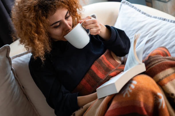 istock Reading A Book With Mug Of Coffee 1383129557