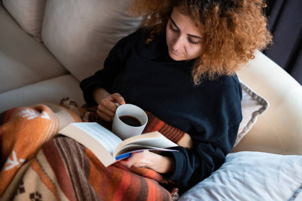 istock Reading A Book With Mug Of Coffee 1383129582