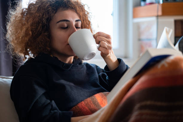 istock Reading A Book With Mug Of Coffee 1383129583