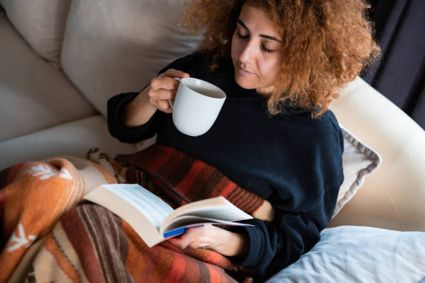 istock Reading A Book With Mug Of Coffee 1383129587