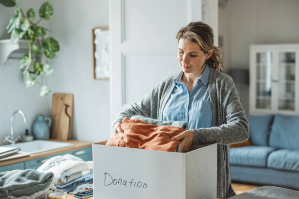 istock Woman preparing donation box at home 1383133103