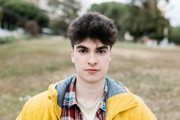 istock Young student boy looking at camera outdoors 1383133494