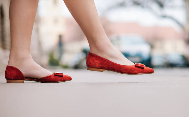 istock female legs wearing elegance shoes 1383137095