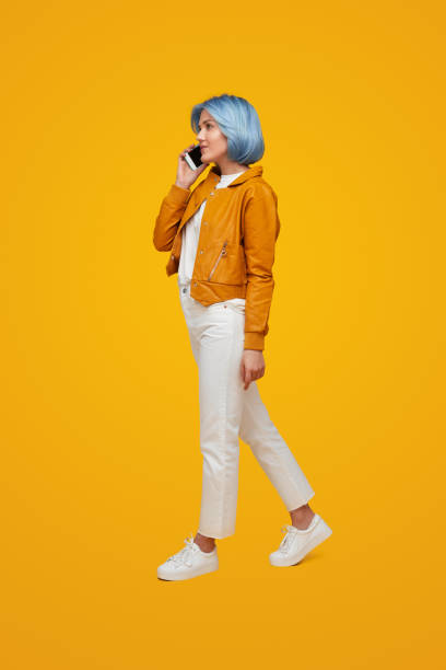 istock Stylish woman speaking on smartphone 1383176491