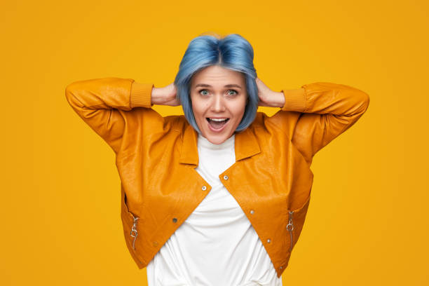istock Excited woman with hands on head 1383176503