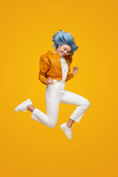 istock Excited woman jumping and celebrating success 1383176505