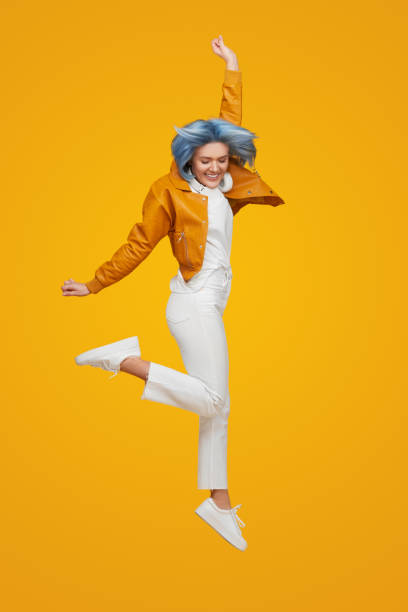 istock Excited female winner jumping in air 1383176511