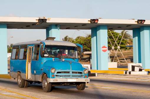Vintage American bus speeding in Havana, Cuba.
