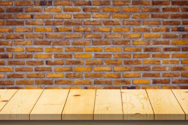 istock Wood table top on old vintage brick wall background product display 1383177104