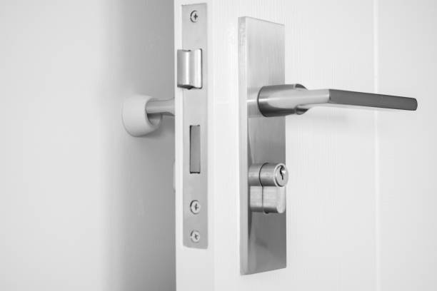 istock Wall mounted door stopper with modern door handle 1383177700