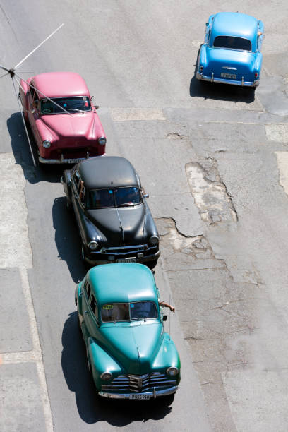 Old American Cars Driving in Havana, Cuba stock photo