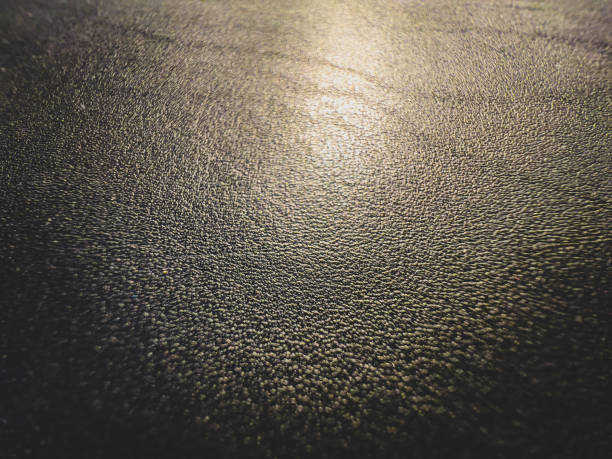 istock A macro image of fine black leather in the light. 1383195441