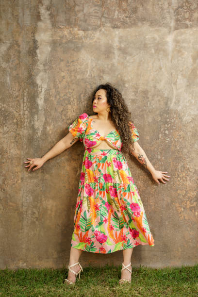 istock She is posing on a grunge concrete wall background 1383197032