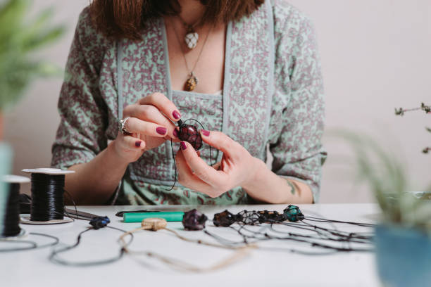 istock Women artisan creates jewellery 1383215694