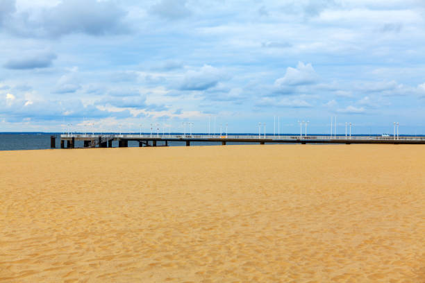 Costa da Caparica Portugal Lisbon . Sandy beach with harbor