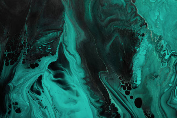 istock Fluid Art. Green abstract wave swirls on black background. Marble effect background or texture 1383235465
