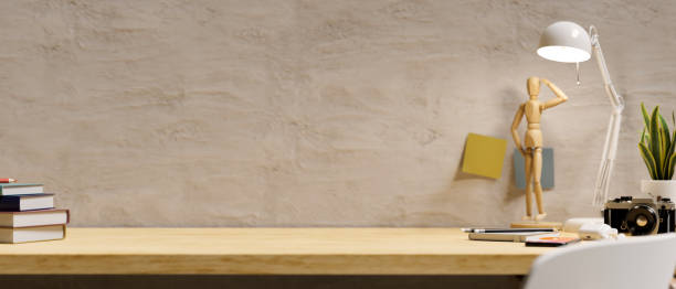 istock Modern wooden tabletop with accessories and copy space against the loft wall. 1383246270
