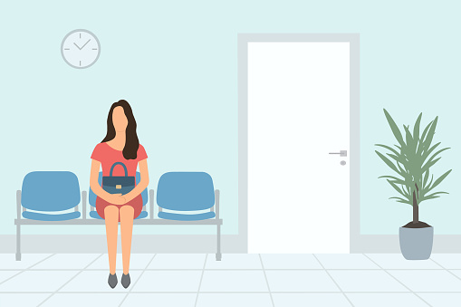 Young Woman Waiting Appointment Time In Hospital Or In Office