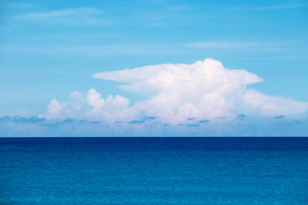 istock Blue sea with big white clouds and sky. 1383297954
