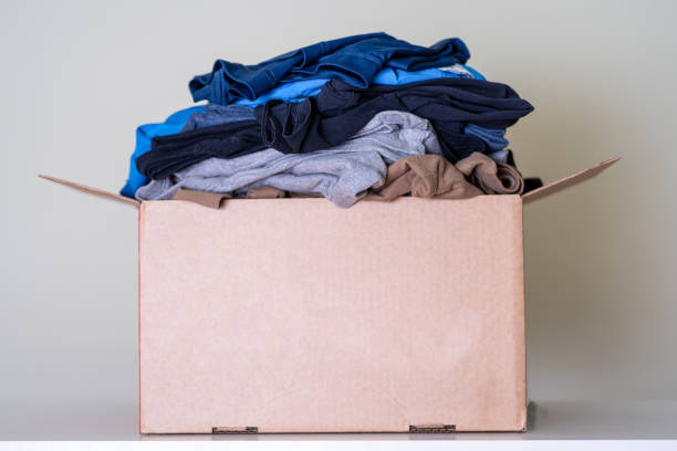 istock A large brown cardboard box filled with things. 1383308888