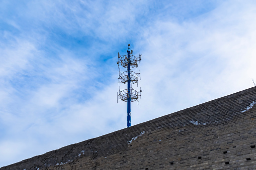 5G base station antenna tower standing on the street