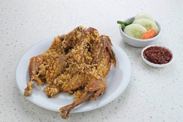 Ayam Goreng Kremes, Indonesian cuisine, fried chicken that cooked with special spice Ayam Goreng Kremes, Indonesian cuisine, fried chicken that cooked with special spice, combined with crispy fried flour (kremes). drumstick stock pictures, royalty-free photos & images