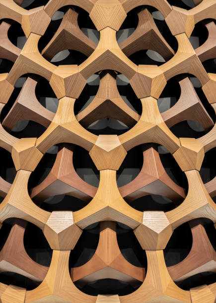 Luxurious geometric wooden curved triangles and circles from part of the wall of entrance of a residential building in Istanbul. Architectural wood work. The concept of modern architecture, design and interior. Modular canopy or roof\nAbstract wooden background. Wood background.