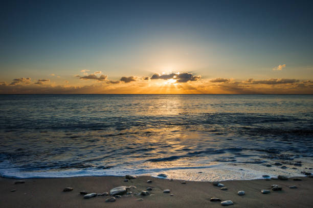istock Perfect seascape view from a beach at sunset 1383332107