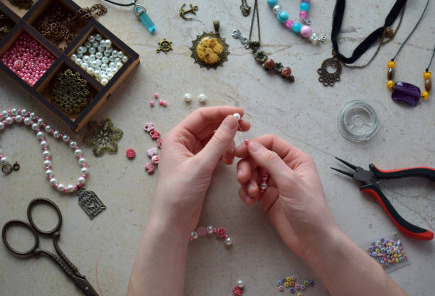 istock Making the jewelry. Needlework accessories for creating bracelet, chain from beads. DIY project. Small business. Income from hobby. 1383334682