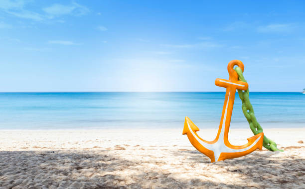 istock Colorful anchor on the beach 1383359974