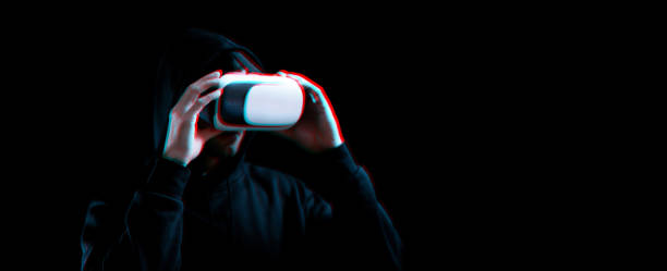istock Vr glasses virtual reality. Blured young man in digital headset for virtual reality technology on dark background with glitch effect. Amazing technology, online game, entertainment. 1383362483