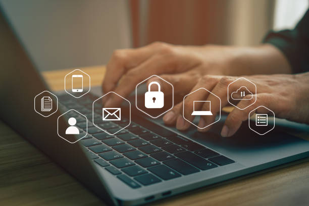 istock Businessmen protecting personal data on laptop and virtual interfaces 1383386846