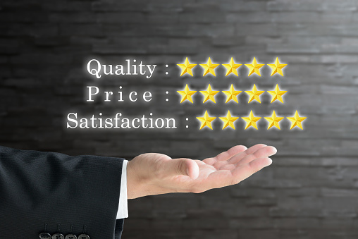 Business man' hand and 5 stars, evaluation and assessment images for quality, price anbd satisfaction