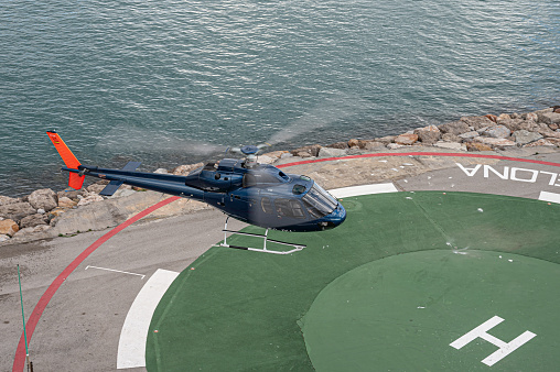 Barcelona, Spain; October 5, 2021:  Blue helicopter on the heliport AS355 Ecureuil 2 / Twin Squirrel 2