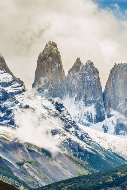 istock Torres del Paine peaks coming from clouds 1383393716