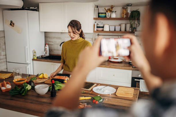 istock Woman making sushi 1383396597