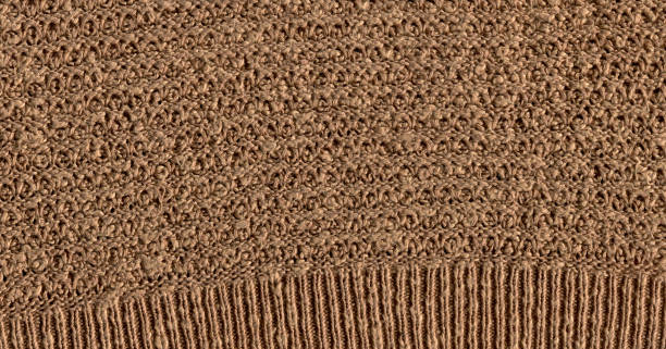 istock Brown vermillion knitted background with copy space 1383401974