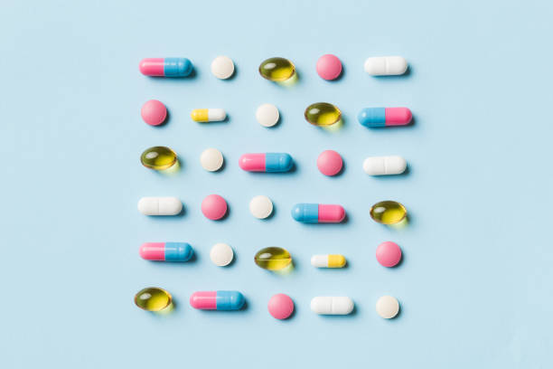 Many different pills and space for text on colorful background, top view. Different pills on color background, flat lay Many different pills and space for text on colorful background, top view. Different pills on color background, flat lay. healthcare fitness and herbal medicine banner set stock pictures, royalty-free photos & images