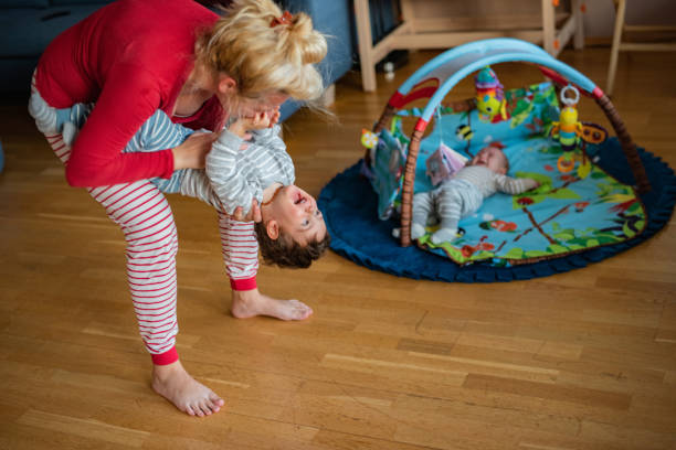 istock Mother playing whit son at home 1383404924