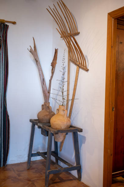 istock Decoration with old country objects. Rakes, jars and tree bark 1383405493