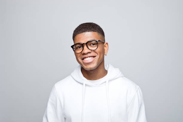 istock Headshot of cheerful young man 1383406567