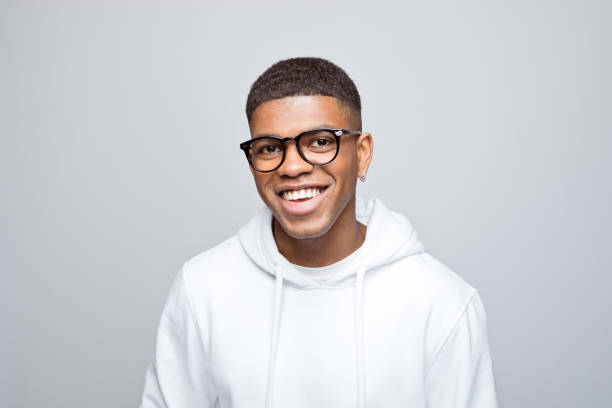 istock Headshot of cheerful young man 1383407112