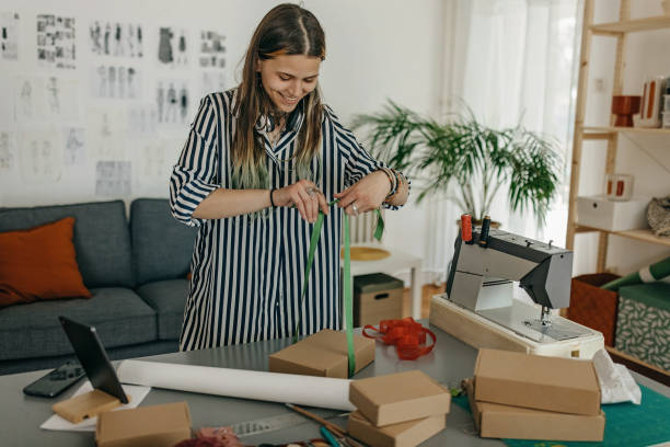 istock Young woman packing the products for shipment 1383408817