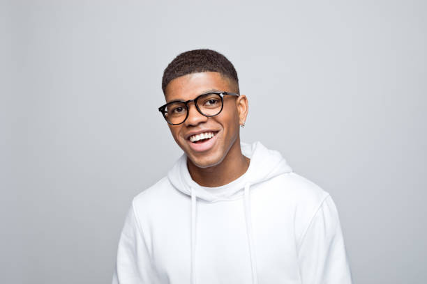istock Headshot of happy young man 1383408873