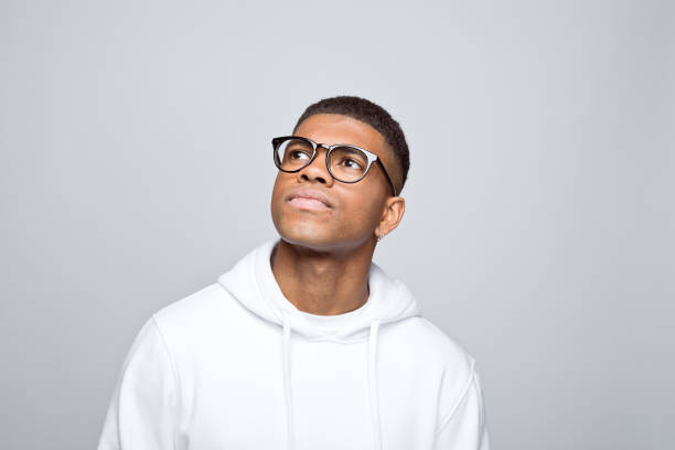 istock Headshot of thoughtful young man 1383408917