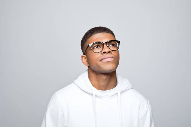 istock Headshot of thoughtful young man 1383408995